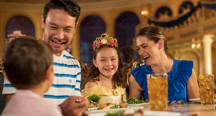Smiling family eating dinner