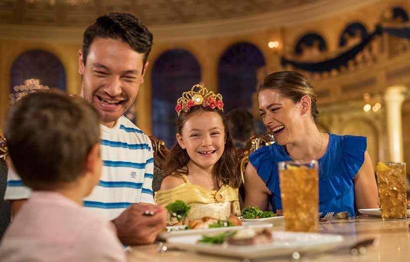 Smiling family eating dinner