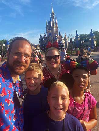 Agent Candice with her family in front of Cinderella Castle