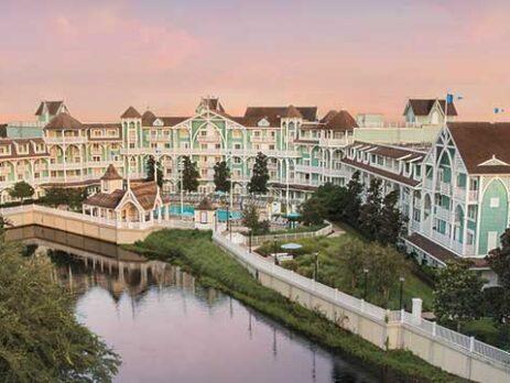 Exterior. view of the Beach Club Resort at dusk