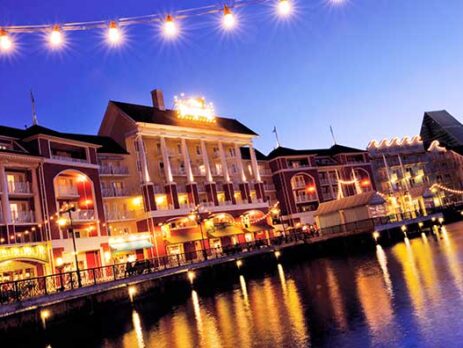 View of Disney's Boardwalk at night with lights reflecting in the water