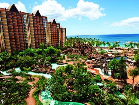 Exterior view of the Aulani resort looking down at the lazy river and pools