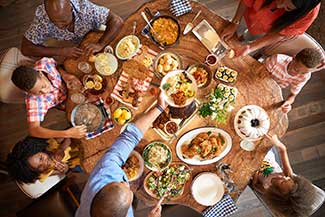 Overhead view of family enjoying a meal together