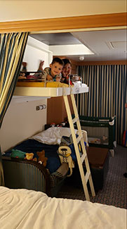 View showing the elevated beds in a Disney Cruise stateroom.