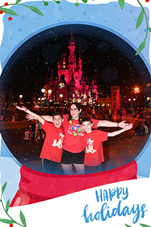 A Memory Maker photo of a family in front of Cinderella Castle at Christmas